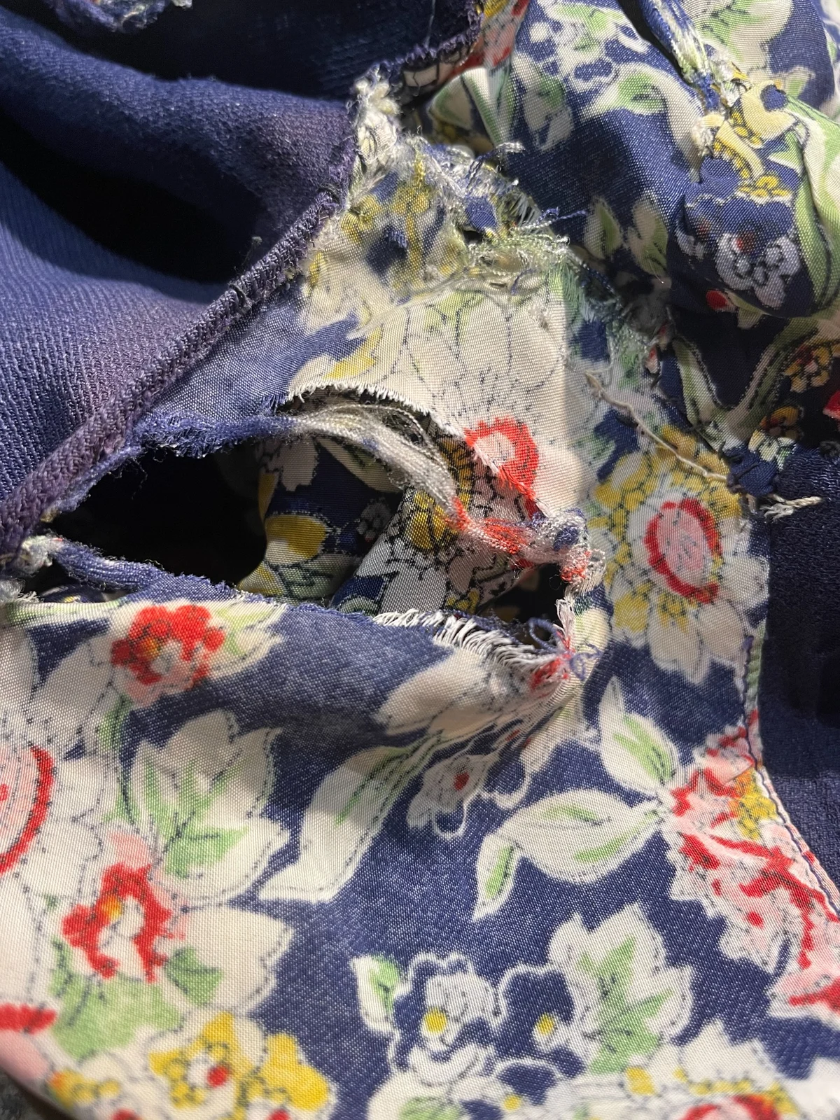 Shattered underarm fabric before Adrienne’s repair